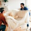 A softly lit new home with cosy armchair, symbolising a change of environment