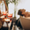 Woman relaxing in a warm bath with bubbles, embodying self-care and intimate wellness