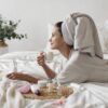 Woman enjoying a self-care treatment at home in soft natural light