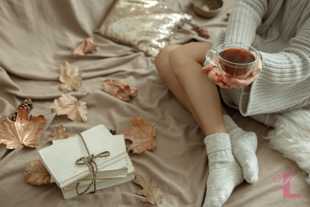 Reinvention Season: Finding Confidence in Your Own Skin 5 Warm autumn morning scene with soft blanket and tea, evoking quiet self-care and confidence