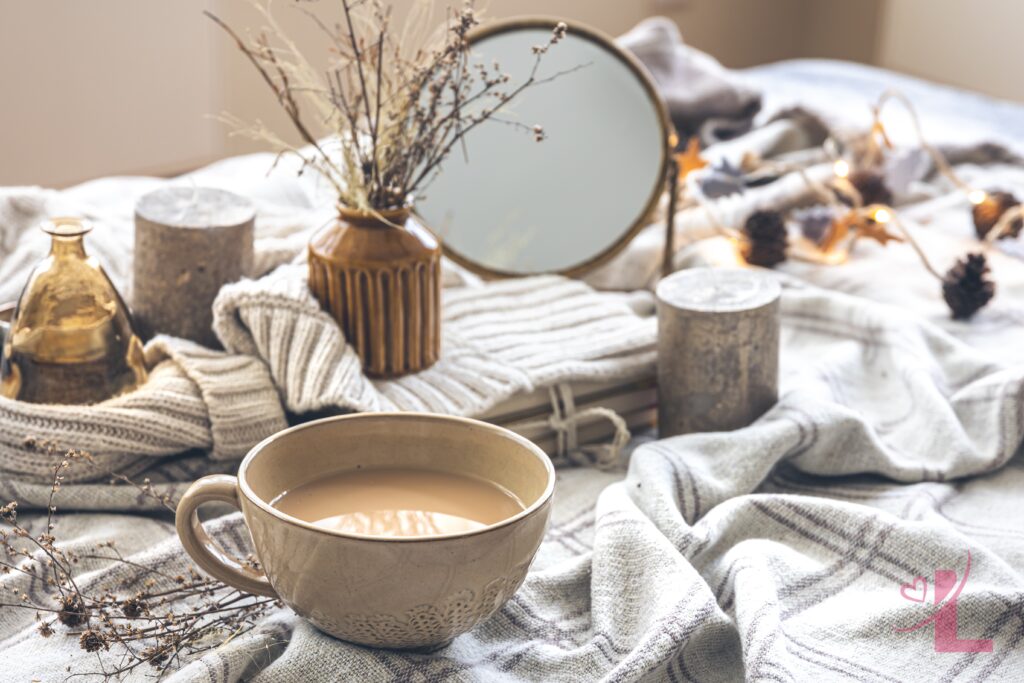 Reinvention Season: Finding Confidence in Your Own Skin 6 Soft candlelight and coffee in bed, a cosy scene for slowing down and reconnecting with yourself