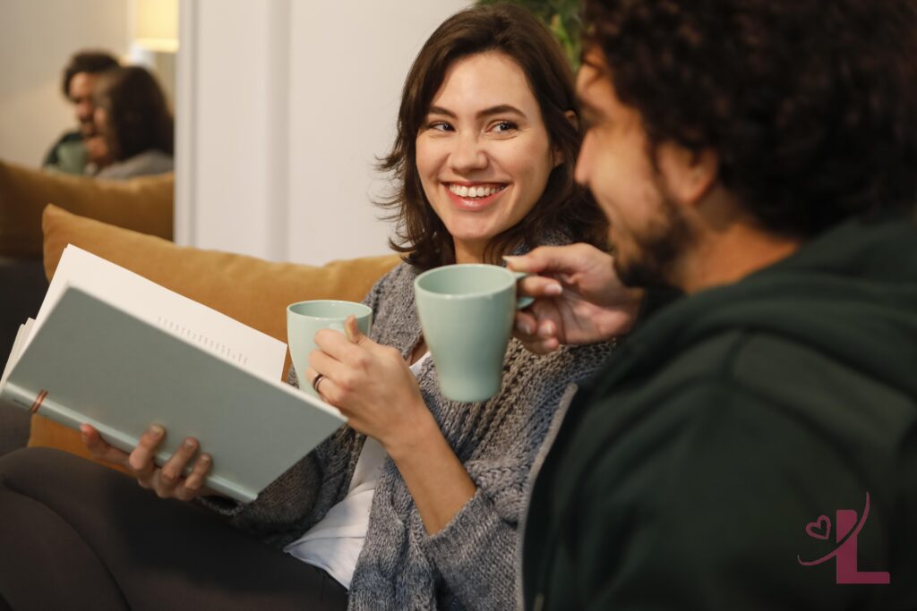 How to Talk About Intimacy With Your Partner (Without the Awkward Silence) 6 Couple sitting together talking openly in their living room