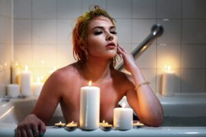 Elegant candlelit setting evoking pelvic wellness and self-care