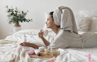 Woman enjoying a self-care treatment at home in soft natural light