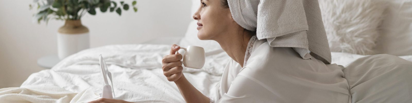 Woman enjoying a self-care treatment at home in soft natural light