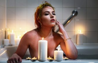 Elegant candlelit setting evoking pelvic wellness and self-care